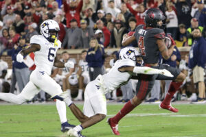 Gabriel scores school record 8 touchdowns as OU dismantles WVU 59-20